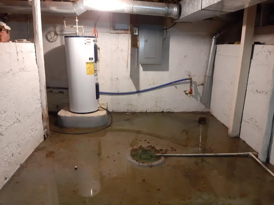Water pooling around a failed water heater in an Encino, CA garage